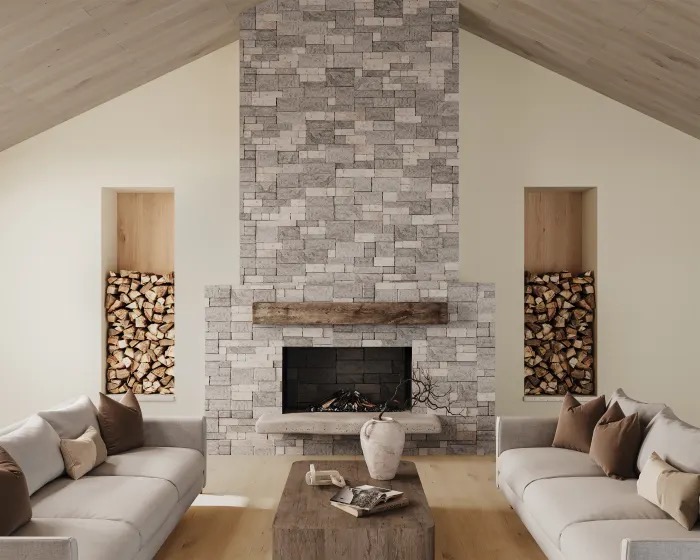 Stacked stone fireplace surround in a vaulted great room